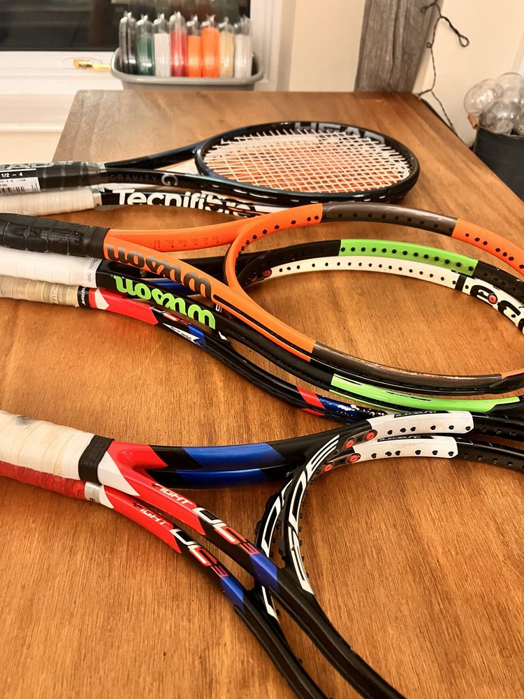 Rackets ready for collection, with string reels behind